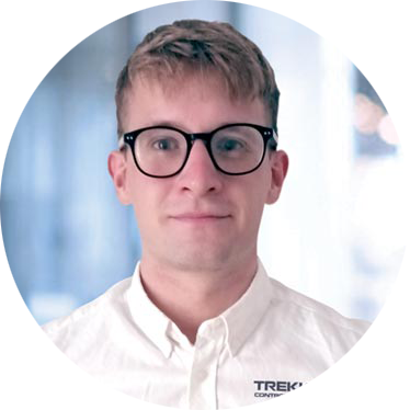 Philip Carey Testimonial Technology professional posing in front of a camera at the Trekkor office for a professional headshot