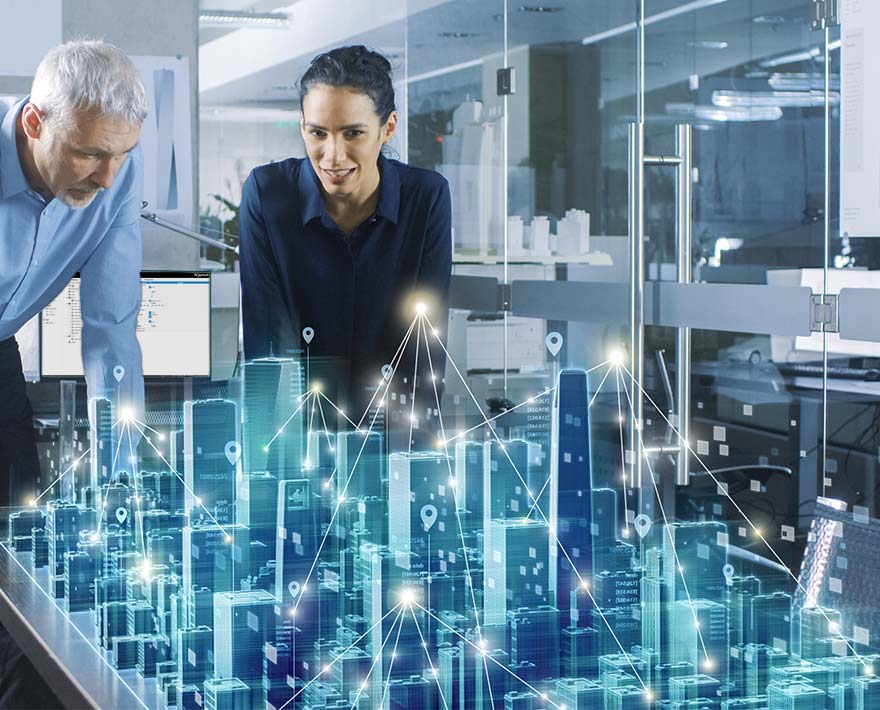 BACnet Controller for Building Management 3D hologram of connected buildings with BACnet controller being analyzed by two people