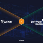 Large blue technical illustration with data dashboards, wind turbines, and power grids, announcing the partnership between N3uron and Software Toolbox for the US distribution of the Industrial Edge Platform for DataOps.